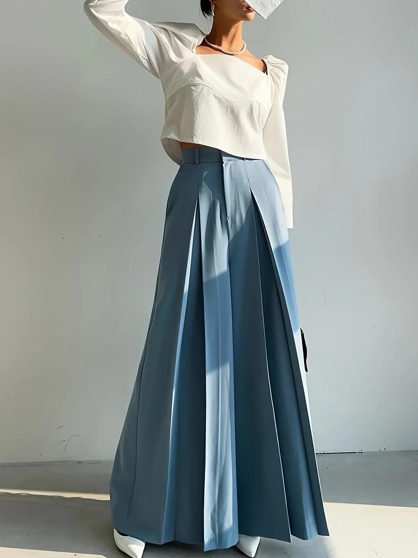 Elegant High-Waist Wide-Leg Pants with Sophisticated Pleated Detailing